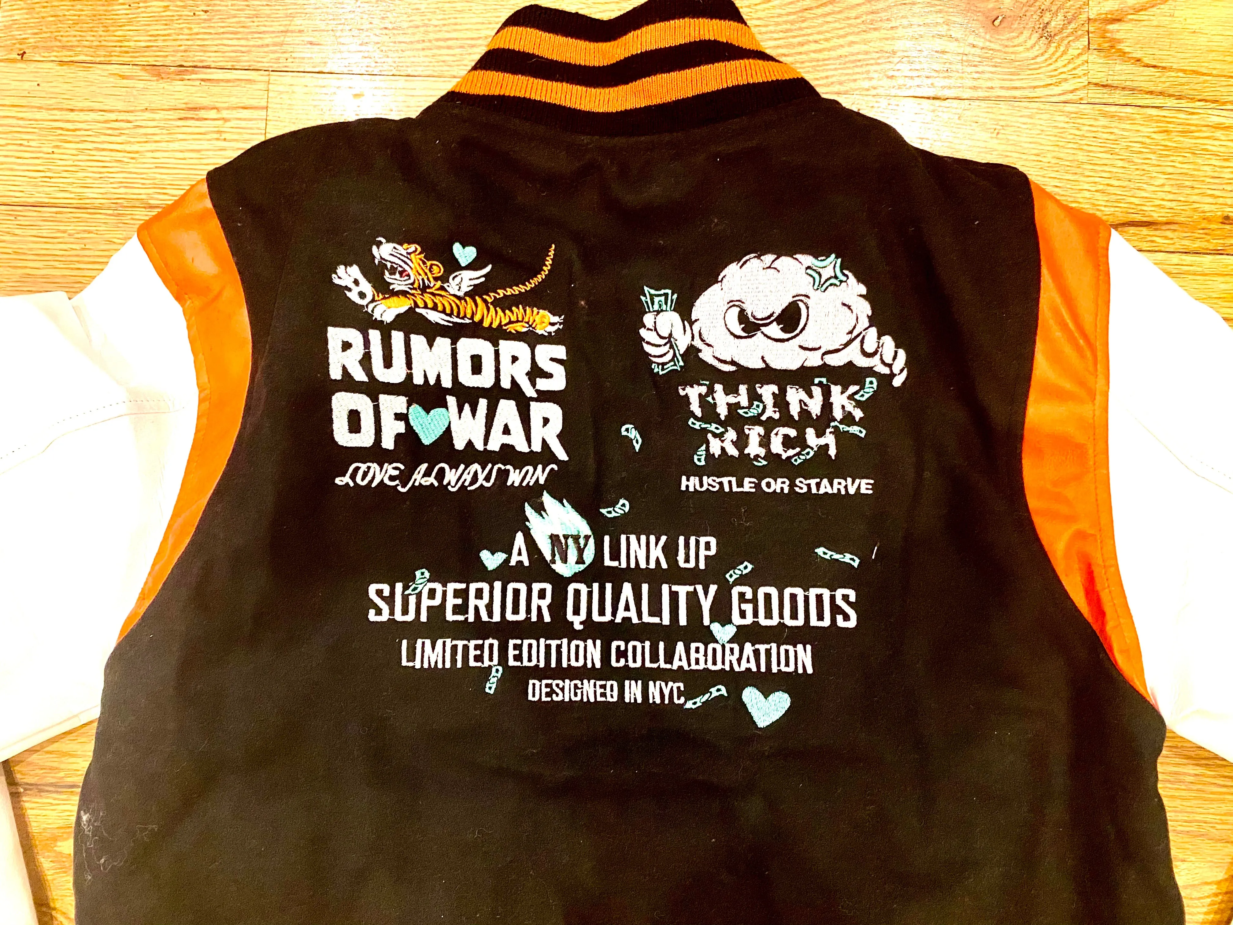 RUMORS OF WAR THINK RICH VARSITY JACKET
