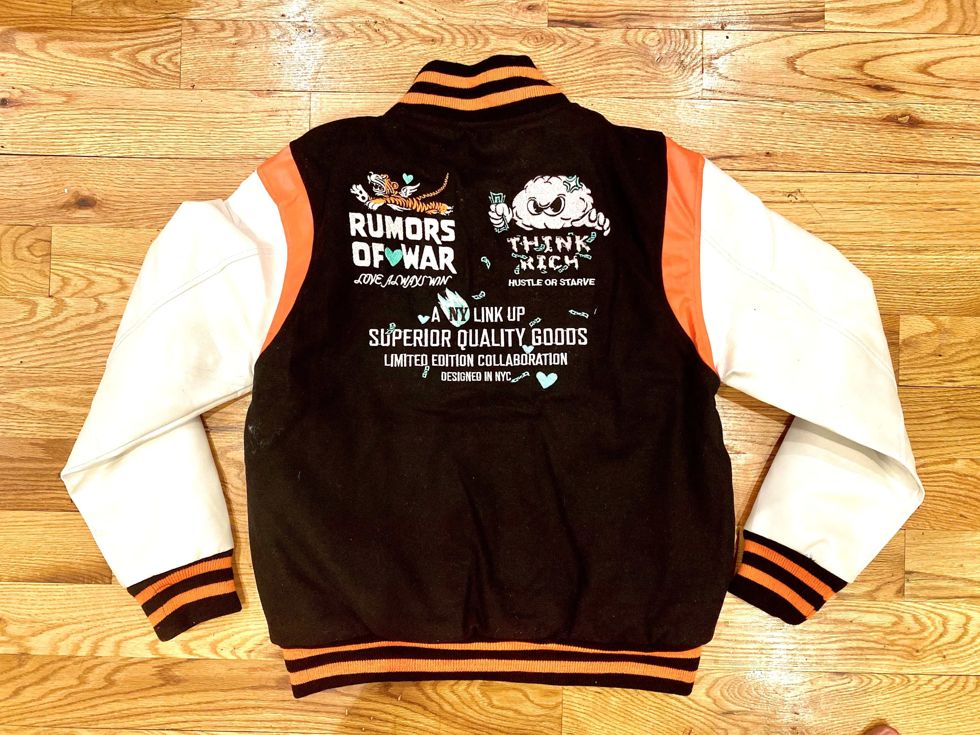 RUMORS OF WAR THINK RICH VARSITY JACKET